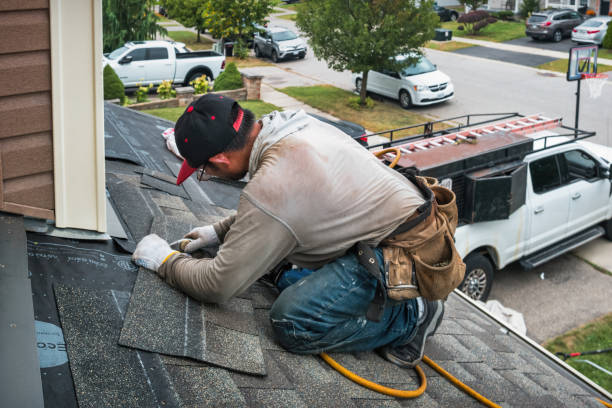 Professional Roofing technician working in Dedham, MA
